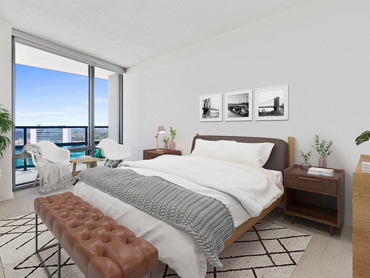 Kingsbury Plaza Bedroom with views of the city, bed and furnishings